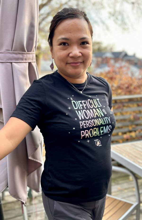 Ethel wearing a black t-shirt that says Difficult Woman with Personality Problems.